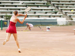 A girl Playing Tennis