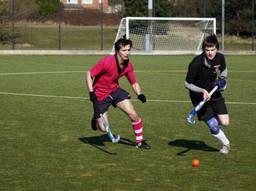 kids playing field hockey