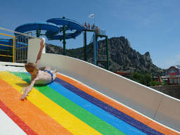A kid on a water slide