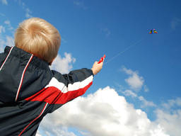 Kite-flying is an outdoor activity that kids can enjoy with their parents.