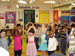 Pre-school kids enjoy moving around and dancing in class.