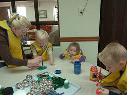 The budding artists concentrate on their arts exercise.