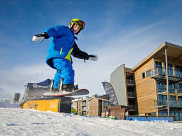 Snowboarding is a popular advanced snow sport among kids today.