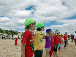 The nippers doing some surf life saving drills.