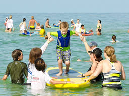 A kid at Sydney Harbour, a popular school holiday destination in Australia