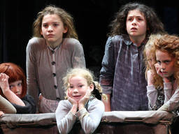 Children performing Annie, a Broadway musical featuring kids