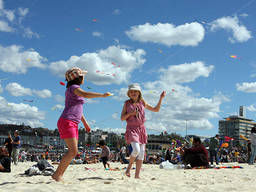 Kite flying is a popular school holiday activity in Bondi Beach.