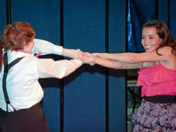 The teens perform salsa dance for their school event.
