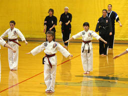 Kids learning self-defence at a martial arts school