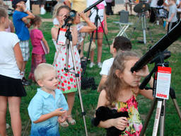 Kids having a closer view of the moon.