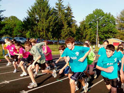 Kids running on the track for a little athletics event