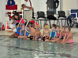 Kids preparing for the swimming leg of a triathlon competition