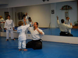 Kids learning and applying Aikido in class