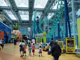 Kids enjoying the amusement centre with their family.