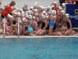 Kids and adults come together for a dip in an outdoor pool!