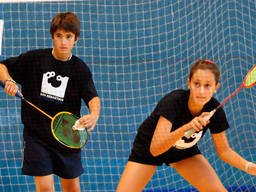 Children staying alert while playing badminton