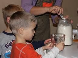 Children participating in cooking exercises.