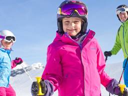 Children enjoying the snow through cross country skiing