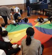 Parachute play always a favourite. Of course it wouldn't be complete without some music and dancing.
