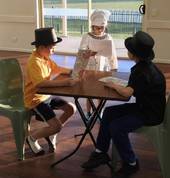 Students taking on the role of diners in a restaurant and chef