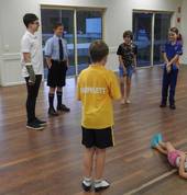 Students enjoying a warm up game of wink murder