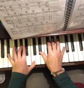 Tara's hands playing piano