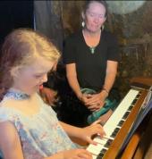 Tara and young piano student