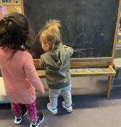 The chalkboard and easel are always popular on rainy days!