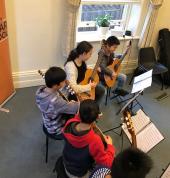 Guitar lessons and ensemble classes for kids.