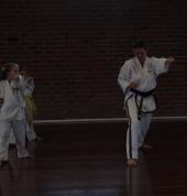 Instructor teaching children martial arts.