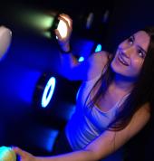 Woman enjoying an interactive light game at Power Play Sydney indoor activity venue