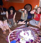 Children with hands on sound instruments at Ashtanga Yoga studio