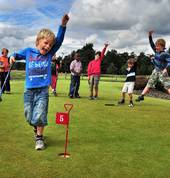 Children enjoying a golf clinic