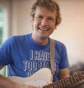 Simon Morel playing guitar in Studio