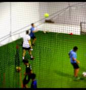 Professional soccer player and head coach of The Soccer Club Kendall Fletcher teaching the drills at the coaching class