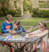 Henry Laurie, Georgia and Jessica enjoy colouring in at Everglades Historic House & Gardens. Photo: David Hill, Headline Publicity