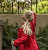 Nina discovers a hidden picture at Everglades Historic House & Gardens. Photo: David Hill, Headline Publicity