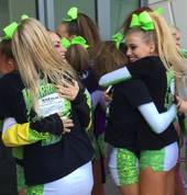 Athletes celebrating, not winning, but hitting their routine which was what they worked towards all year
