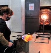 Canberra Glassworks. Annette Blair creating the 2021 Kids Design Competition winning design in the Hotshop. Courtesy of Canberra Glassworks