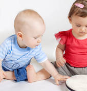 Toddlers playing drum
