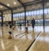 Kids practicing basketball drills with cones and balls at First Pick Basketball training in Melbourne