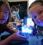 Kids coding robots at our school holiday code camp