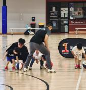 Young players shooting hoops in a trial basketball class at Stonnington Sports Centre, developing balance, reaction, and teamwork.