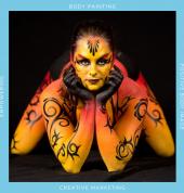 Cirque du Soleil inspired full body painting in shades of red, orange and yellow with black tribal swirls by Brisbane body painter Beth Joyce