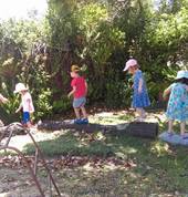 Walking on the logs and developing balance and confidence.