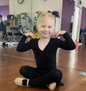 a preschool ballet student in her preschool dance class.