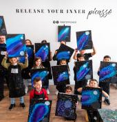 Group of kids with their finished artworks