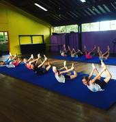 Our Acrodance students strengthening their backs in our colourful studio.
