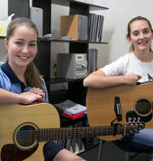 Do Re Mi Studios teacher Monica with her guitar student Katie.