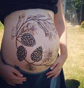 Pregnancy henna art by Adnilem Henna Artist